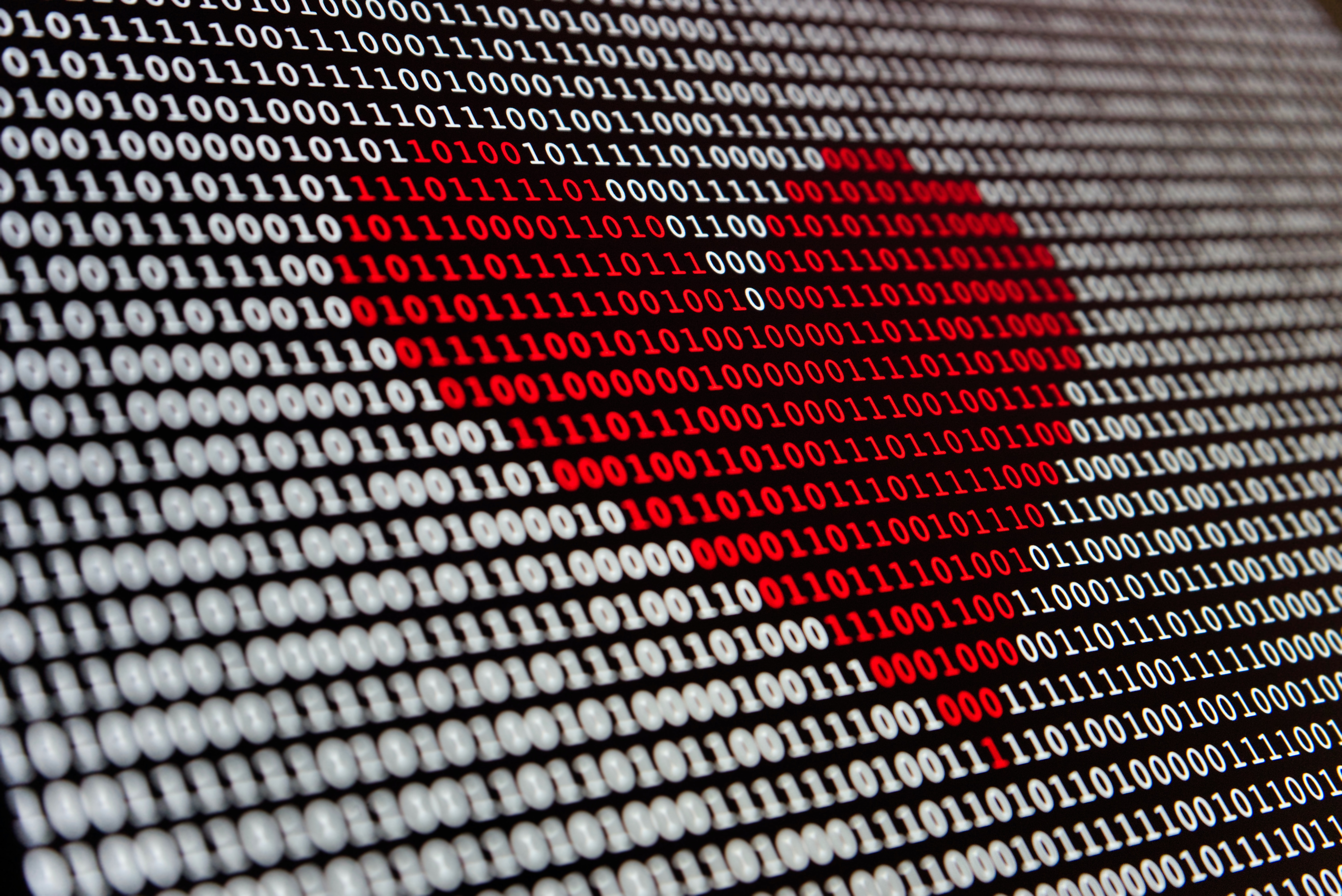 Picture of a heart with digital numbers behind it